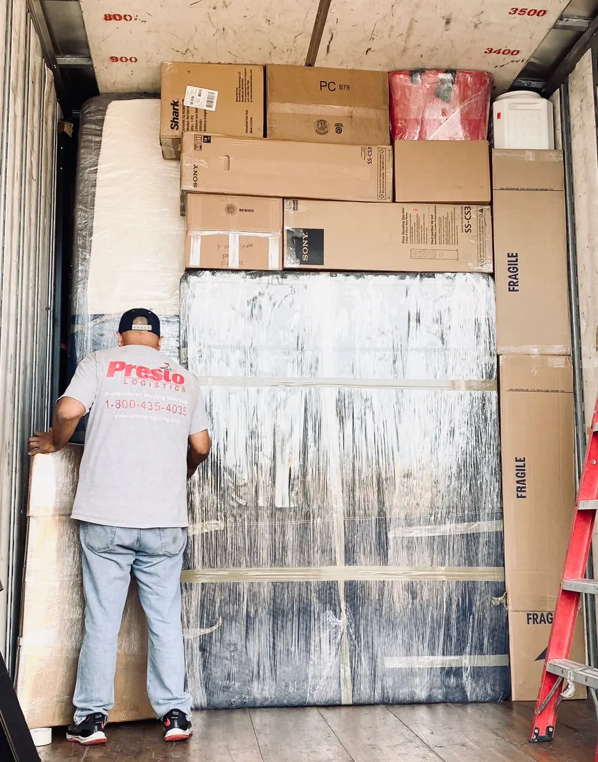 Presto truck loaded tightly with padded furniture
